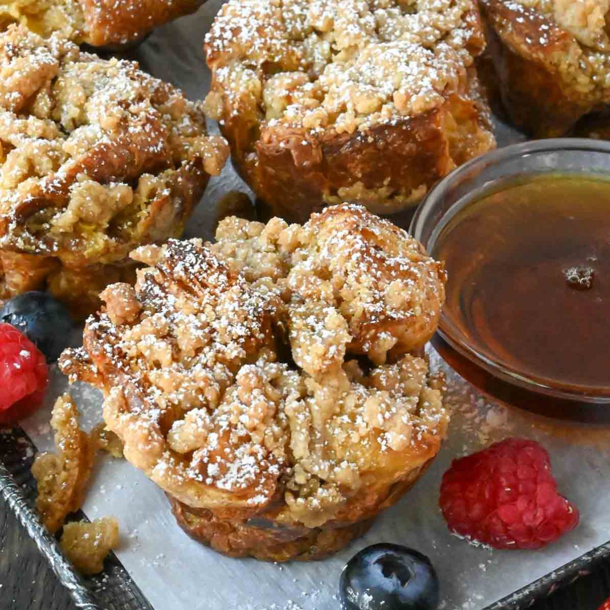 French toast muffins with a side of syrup.
