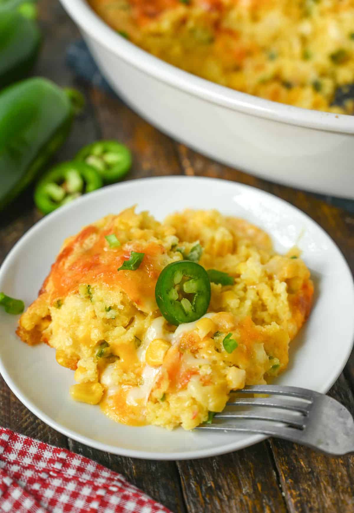 A serving of corn casserole on a white plate.