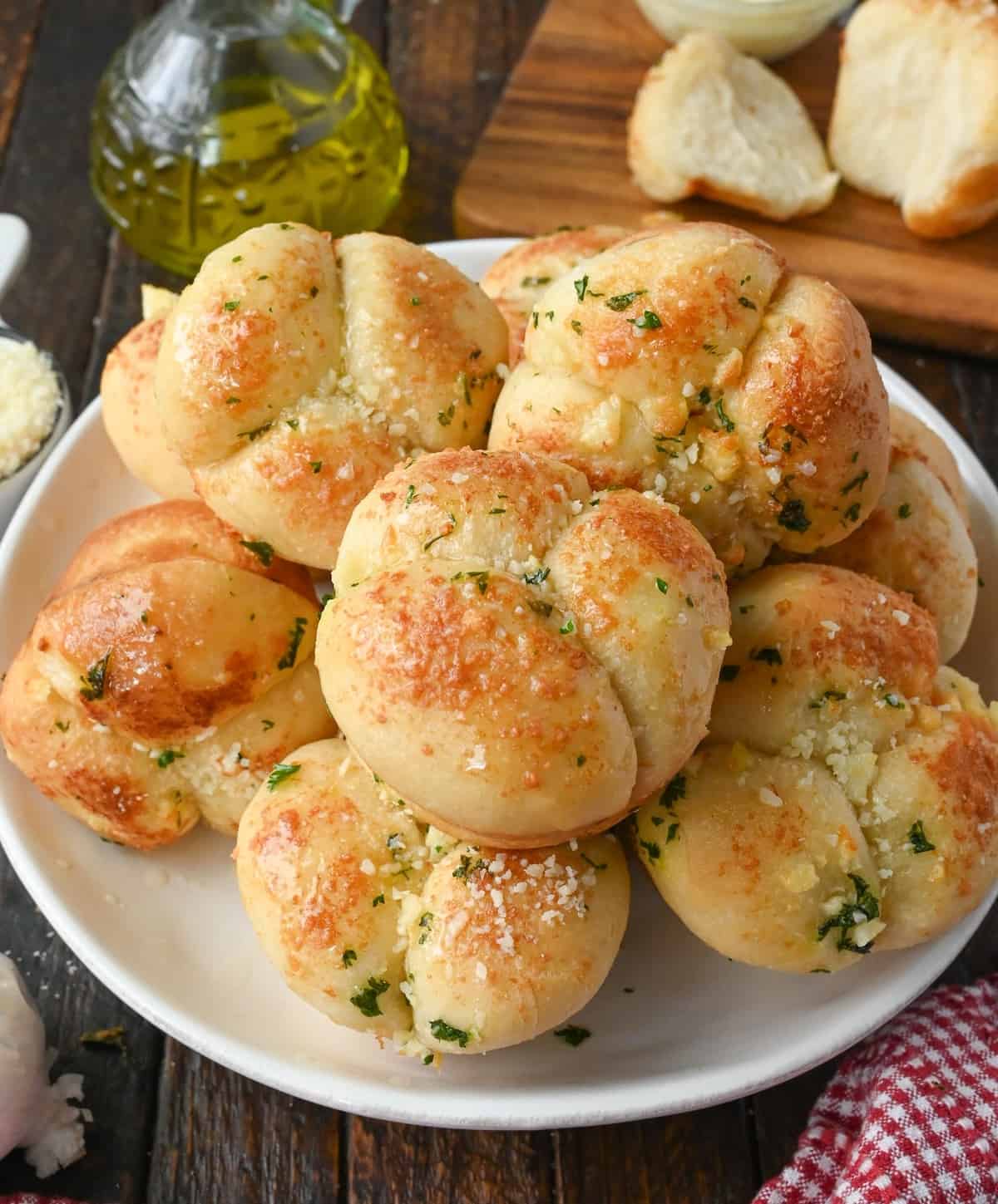 Garlic parmesan dinner rolls on a platter.