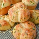 Garlic parmesan dinner rolls in muffins tins.