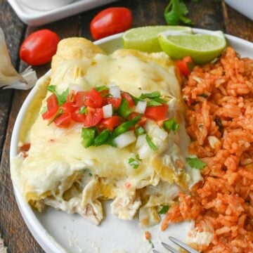 Green chile chicken enchiladas on a plate.