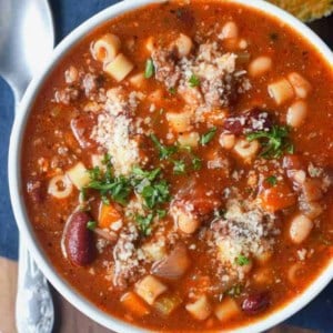 A bowl of food on a table, with Pasta and Soup