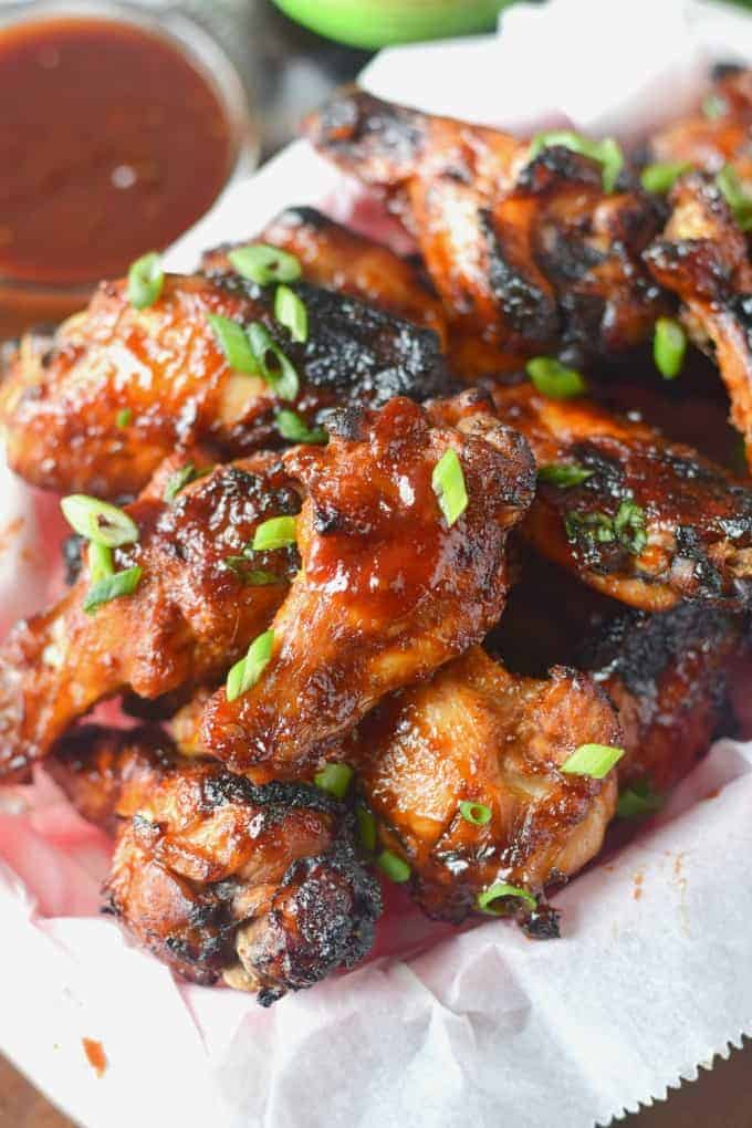 A close-up of rootbeer chicken wings on a plate.