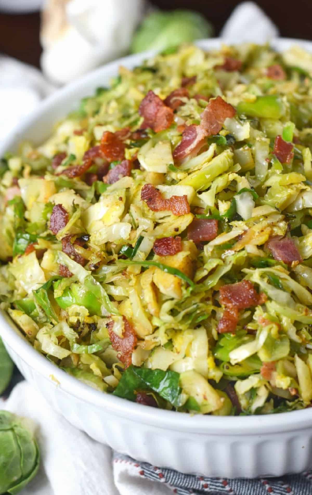 Brussels sprouts with bacon in a bowl.