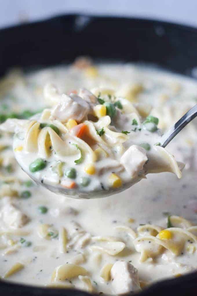 A close up of a bowl of food with Chicken pot pie soup