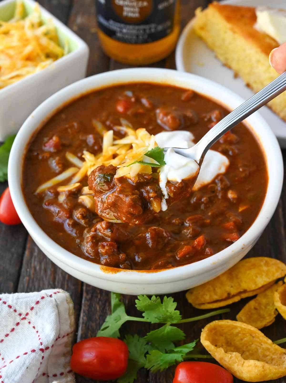 A spoon scooping up some no bean chili.