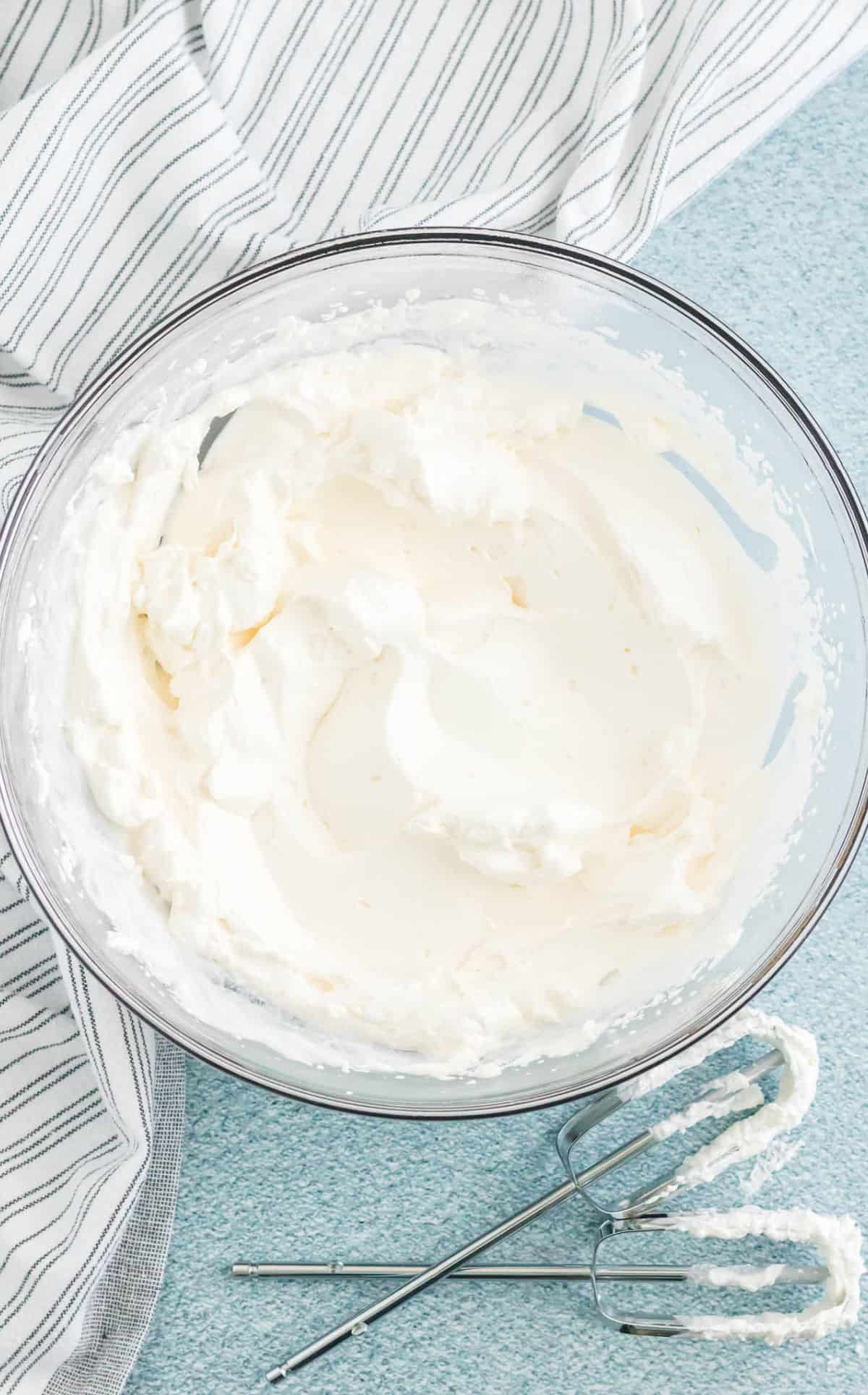 Whipped cream mixed in a bowl.
