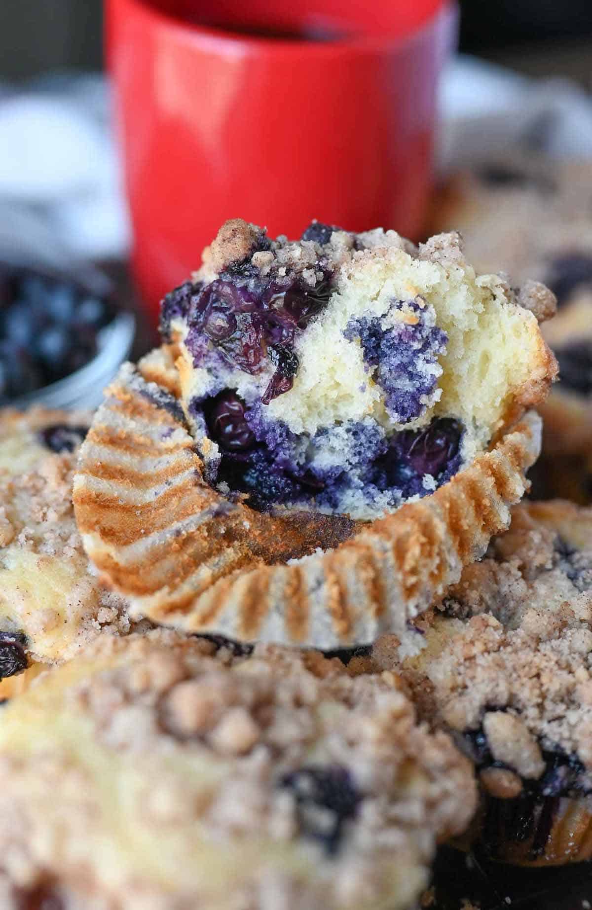 A bite out of a blueberry muffin.