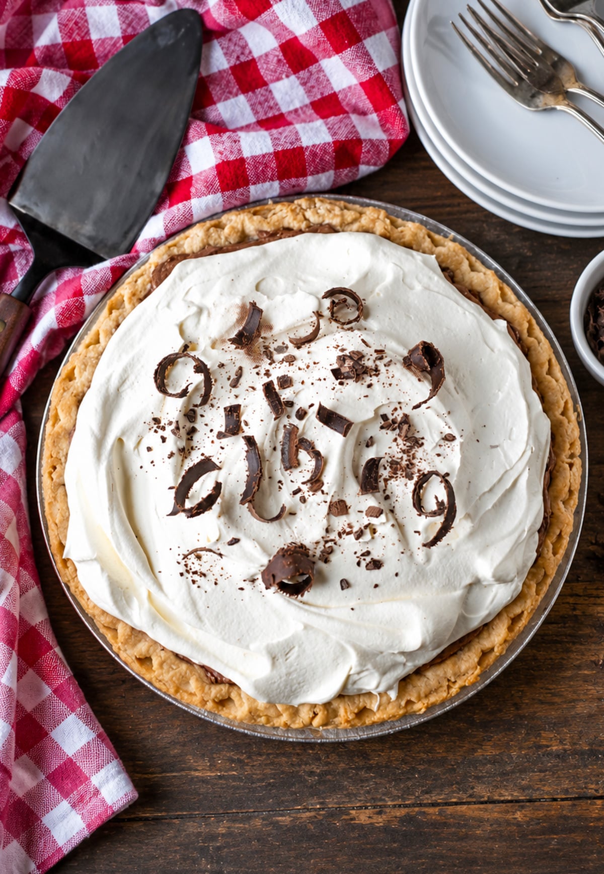 A whole chocolate cream pie with chocolate shavings on top.