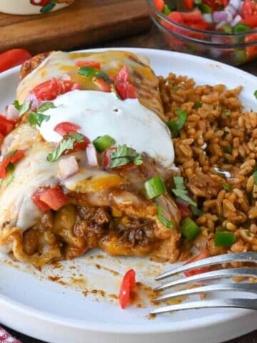 slow cooker beef burrito on a plate.