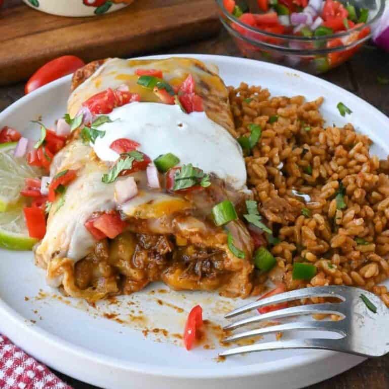 slow cooker beef burrito on a plate.