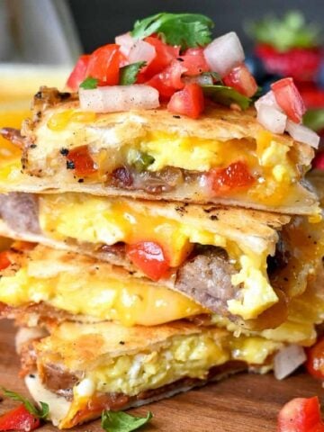 Breakfast quesadillas stacked on top of each other.