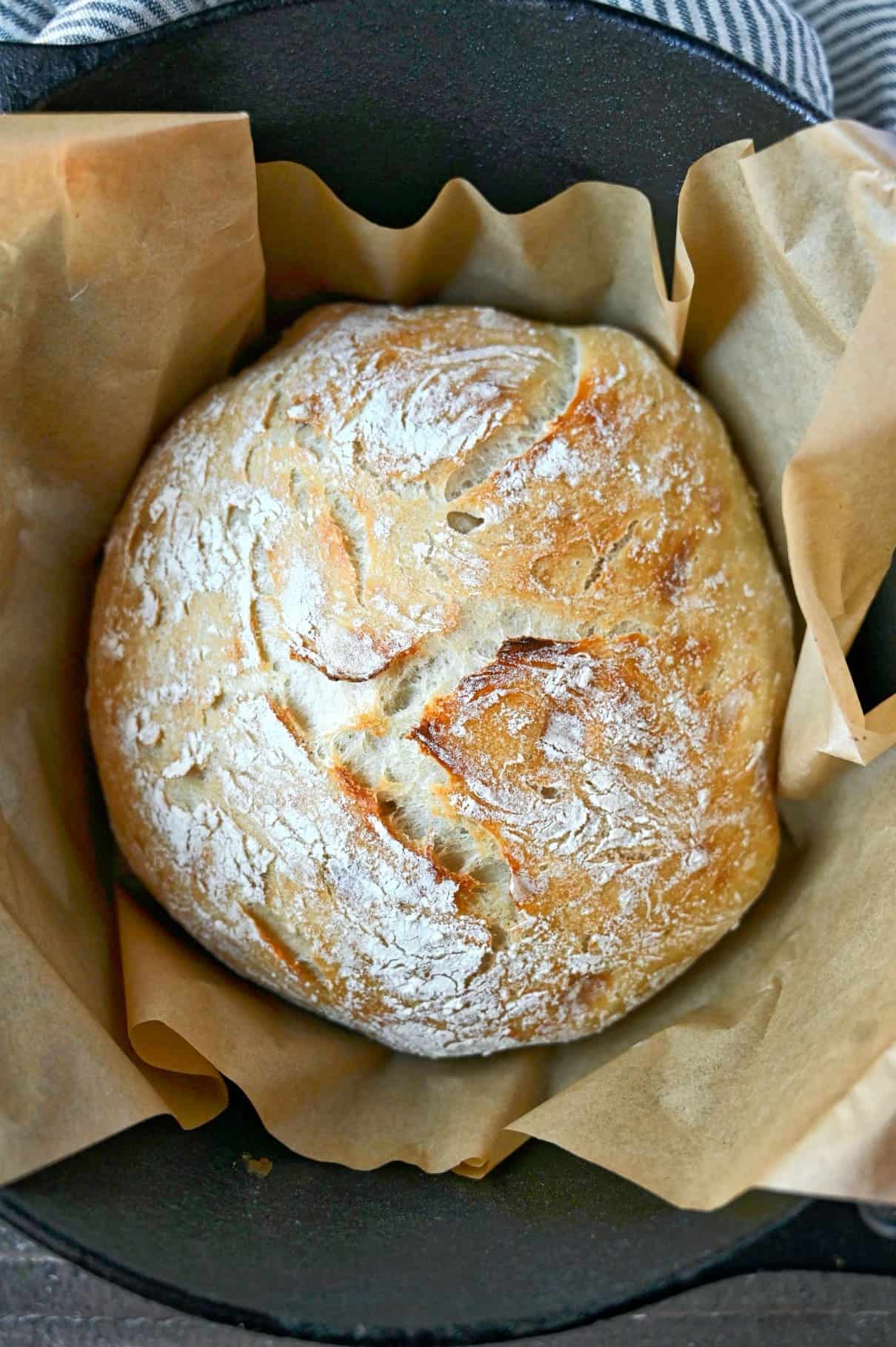 A loaf of artisan bread in a dutch oven.