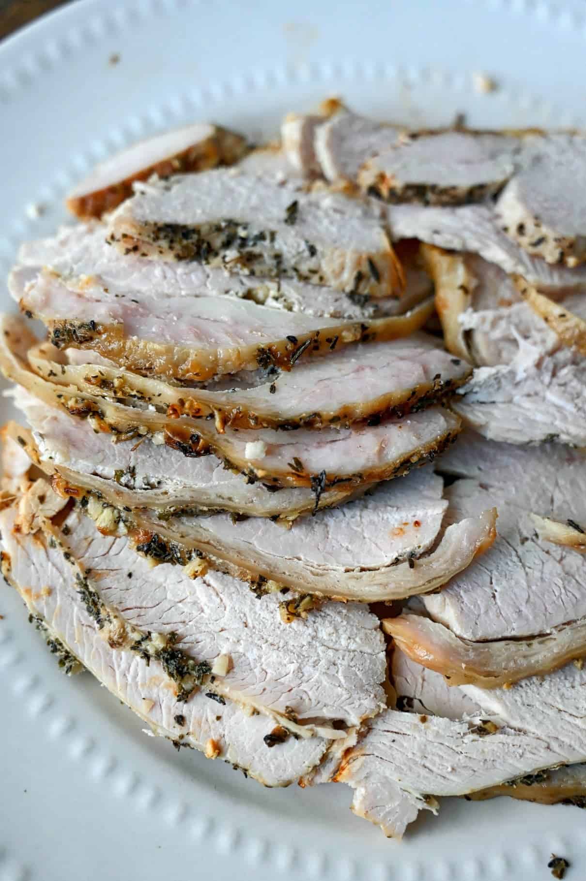 A plate of sliced leftover turkey.