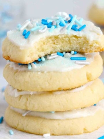 A stack of frosted sugar cookies.