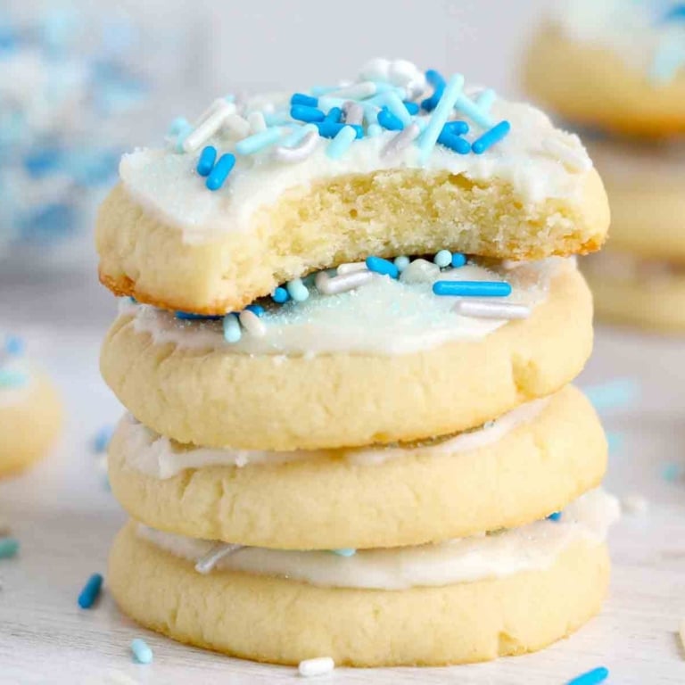 A stack of frosted sugar cookies.
