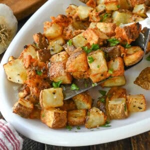 Garlic parmesan potatoes on a platter.