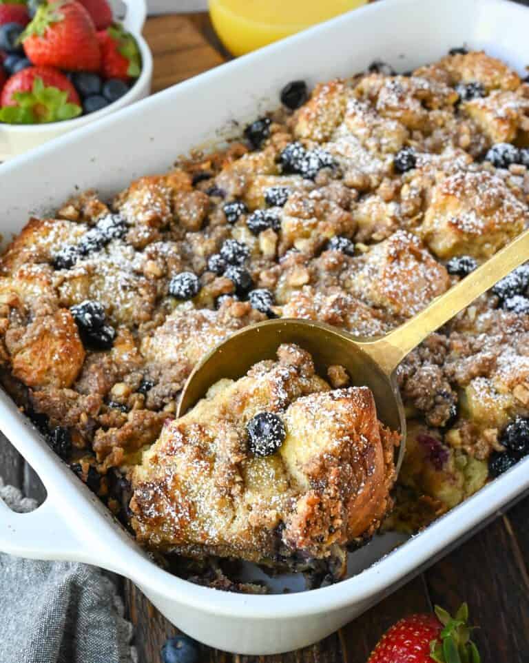 A spoon scooping out some french toast casserole.