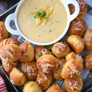 Pretzel bites on a platter with beer cheese.