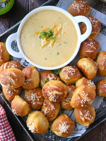 Pretzel bites on a platter with beer cheese.