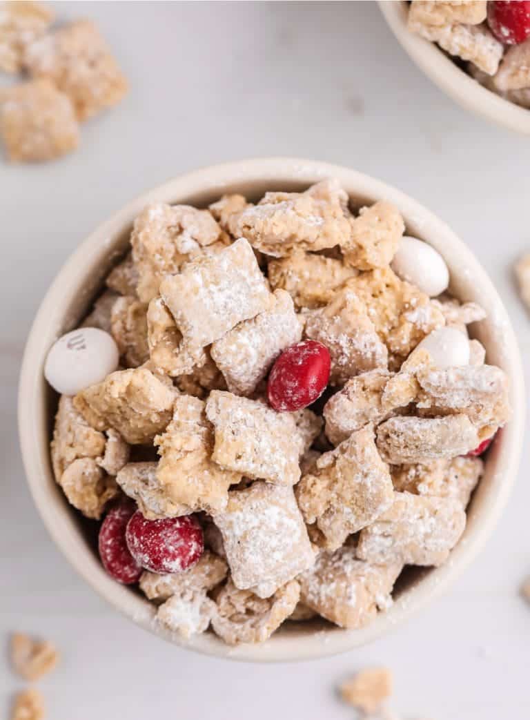 Close up photo of muddy buddies in a white bowl.