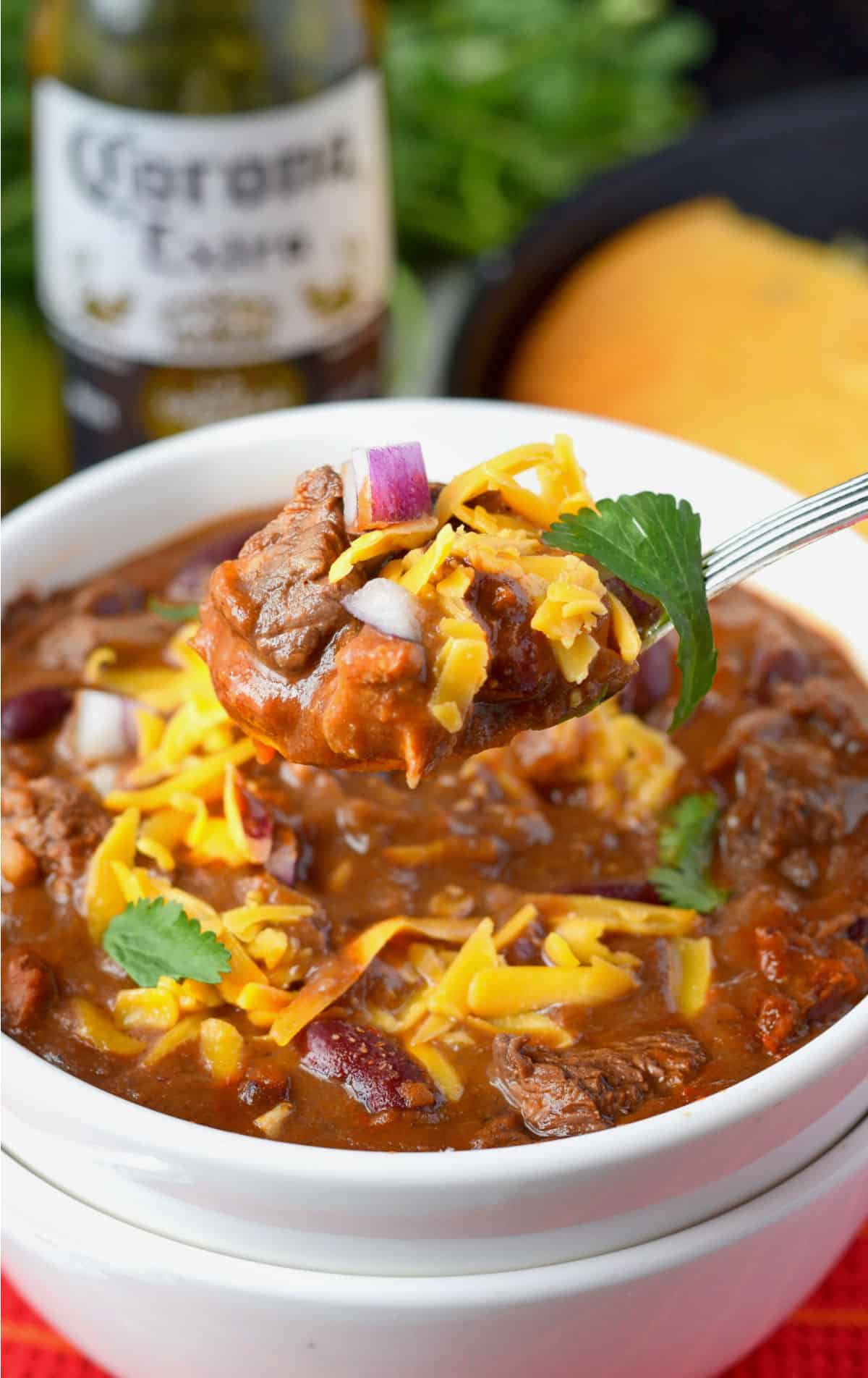 chili in a bowl with a spoon.