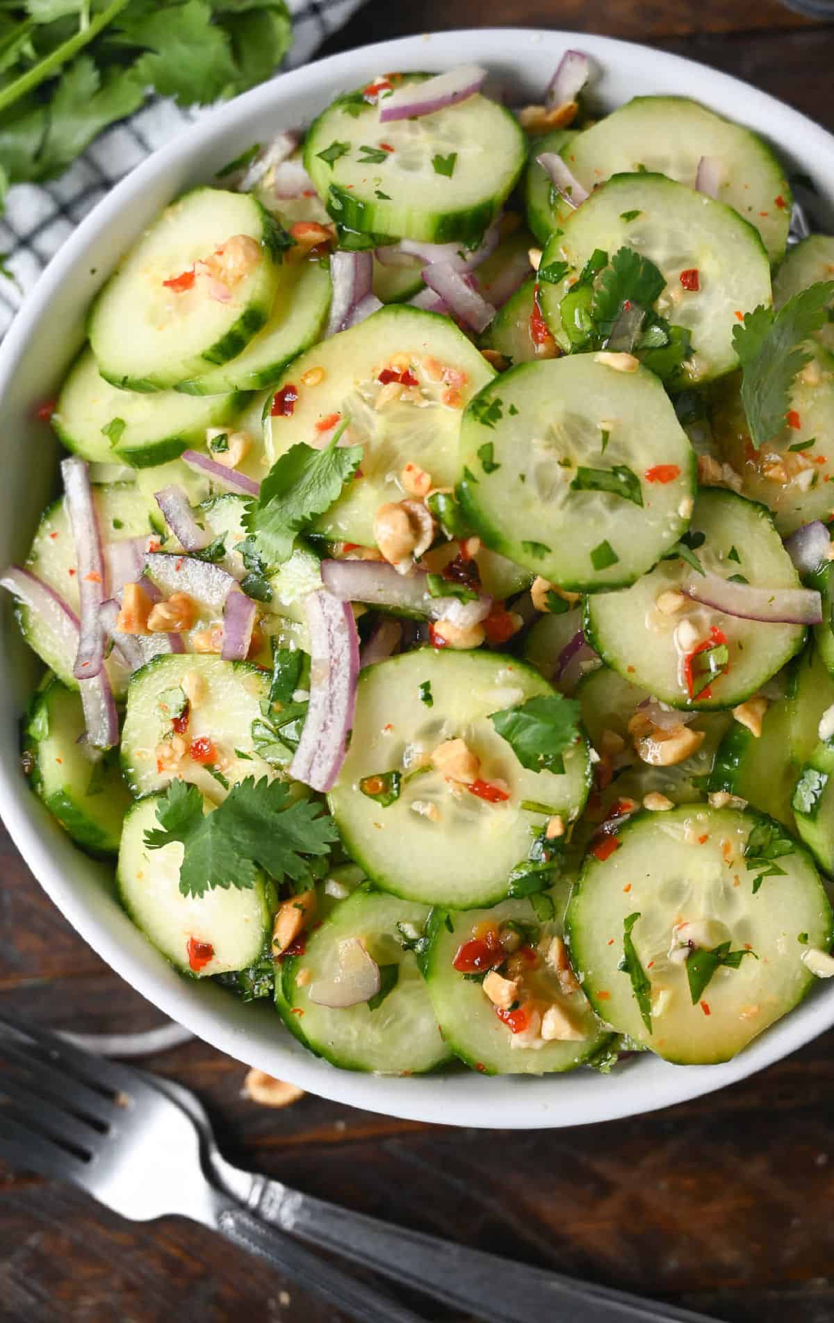 Thai cucumber salad in a white bowl.
