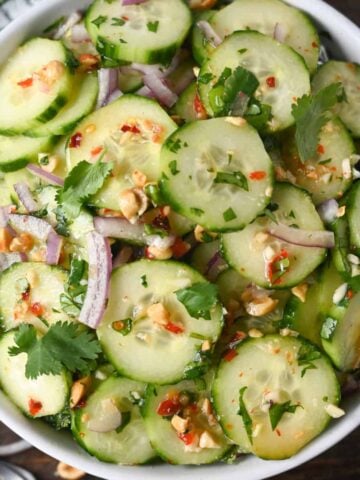 Thai cucumber salad in a white bowl.