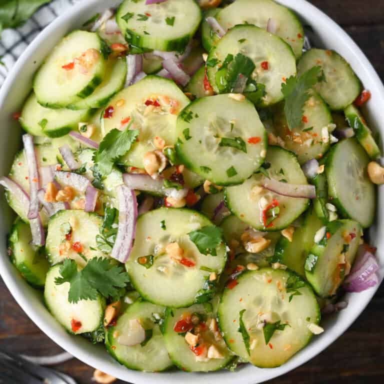 Thai cucumber salad in a white bowl.