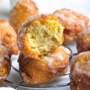 Banana fritters on a wire rack.