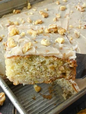 A spatula picking up a slice of banana cake.
