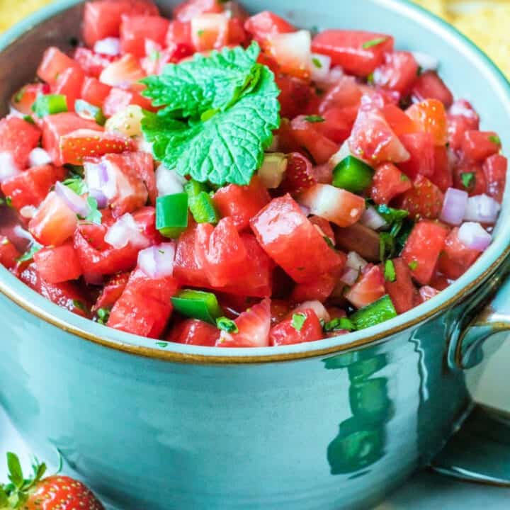 A blue bowl filled with diced watermelon salsa