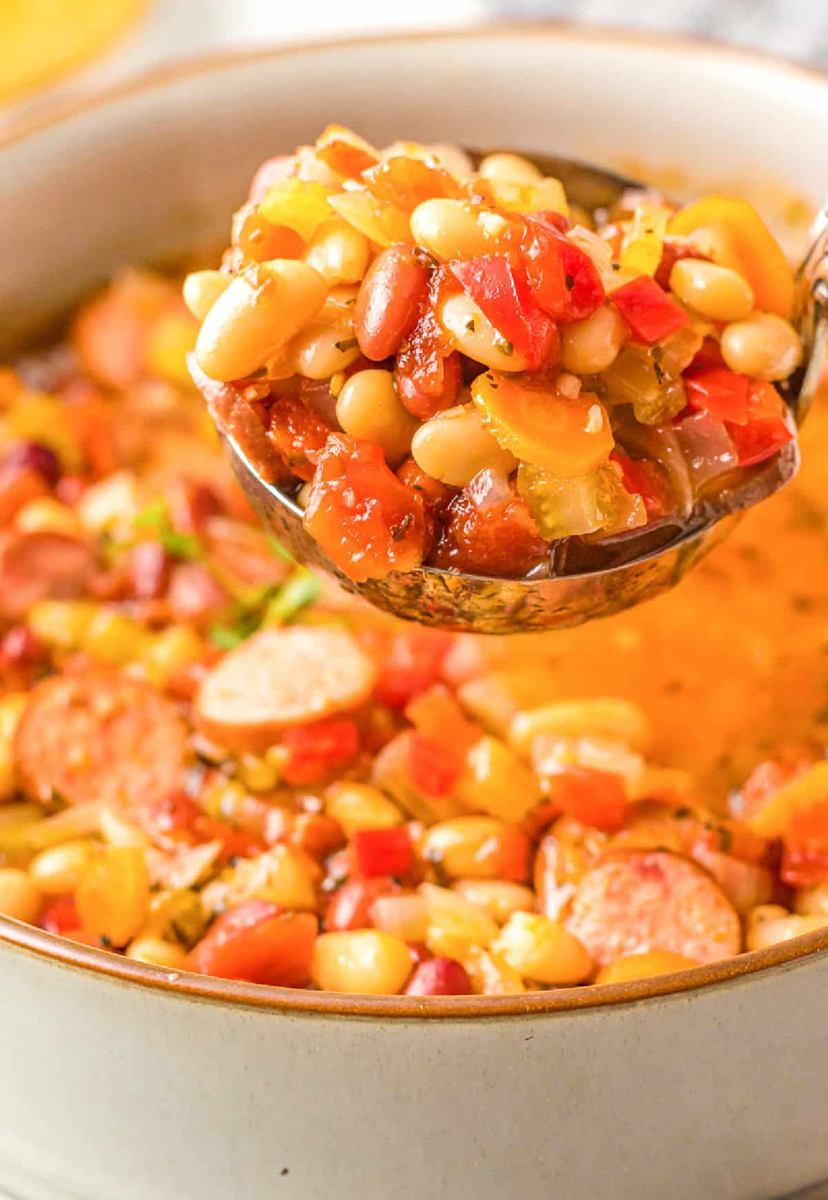 https://butteryourbiscuit.com/wp-content/uploads/2021/08/slow-cooker-sausage-bean-soup-3-1.jpg