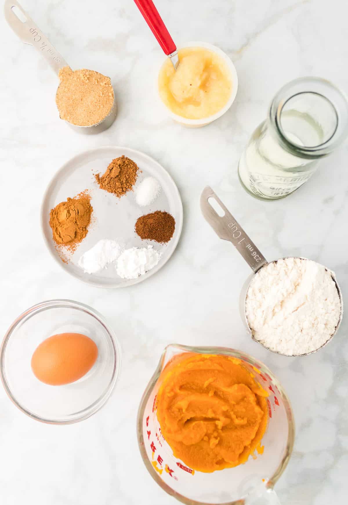 All the ingredients required to make pumpkin muffins.