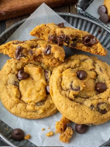 pumpkin chocolate chip cookies on a plate.