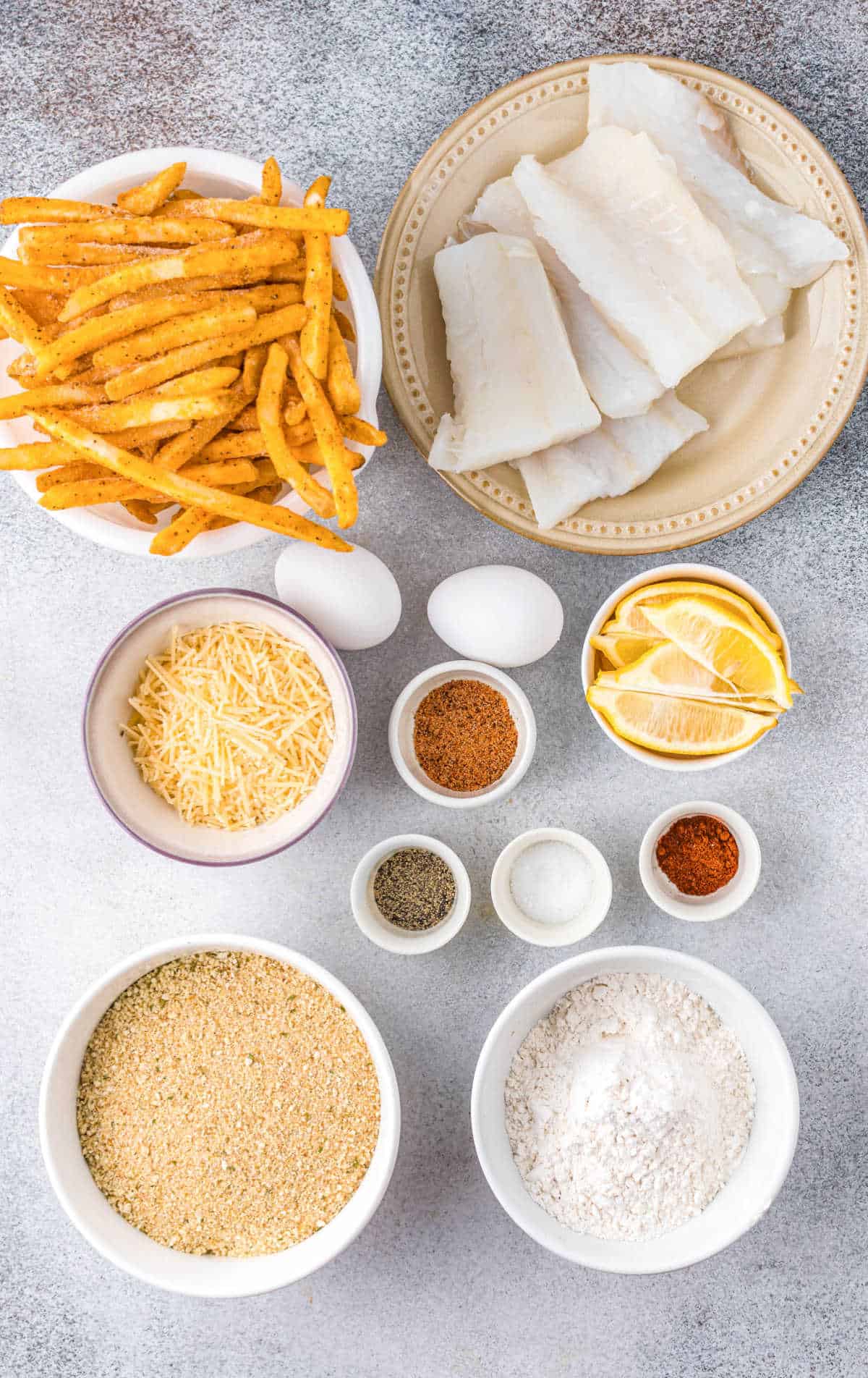 A photo of all the ingredients needed for fish and fries.