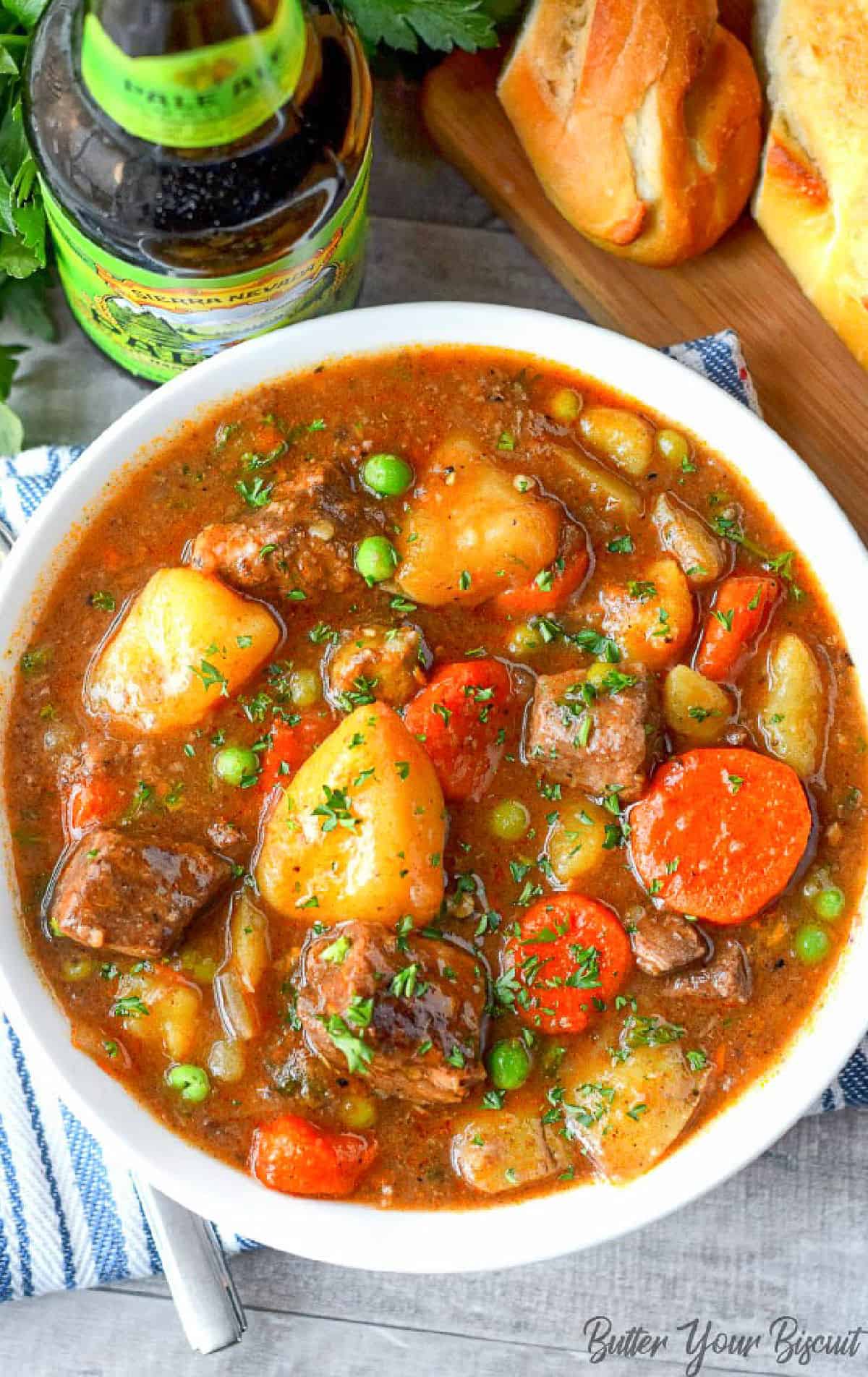 Heart beef stew in a white soup bowl.