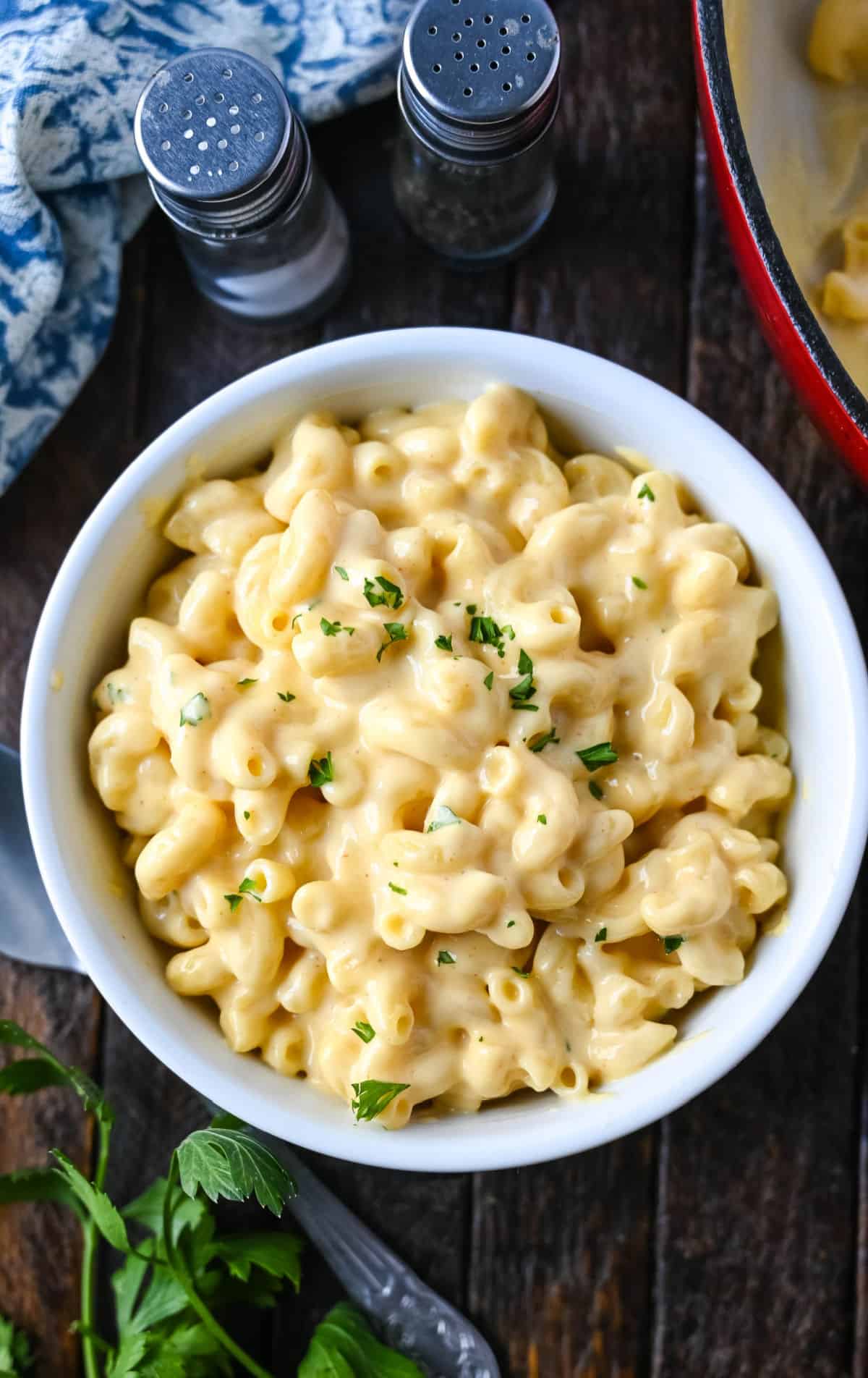 Macaroni and cheese in a white bowl.