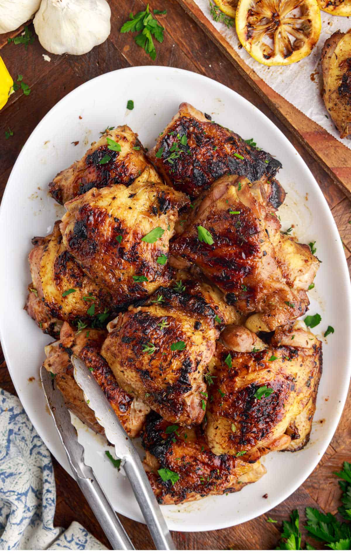 A platter of grilled chicken thighs.