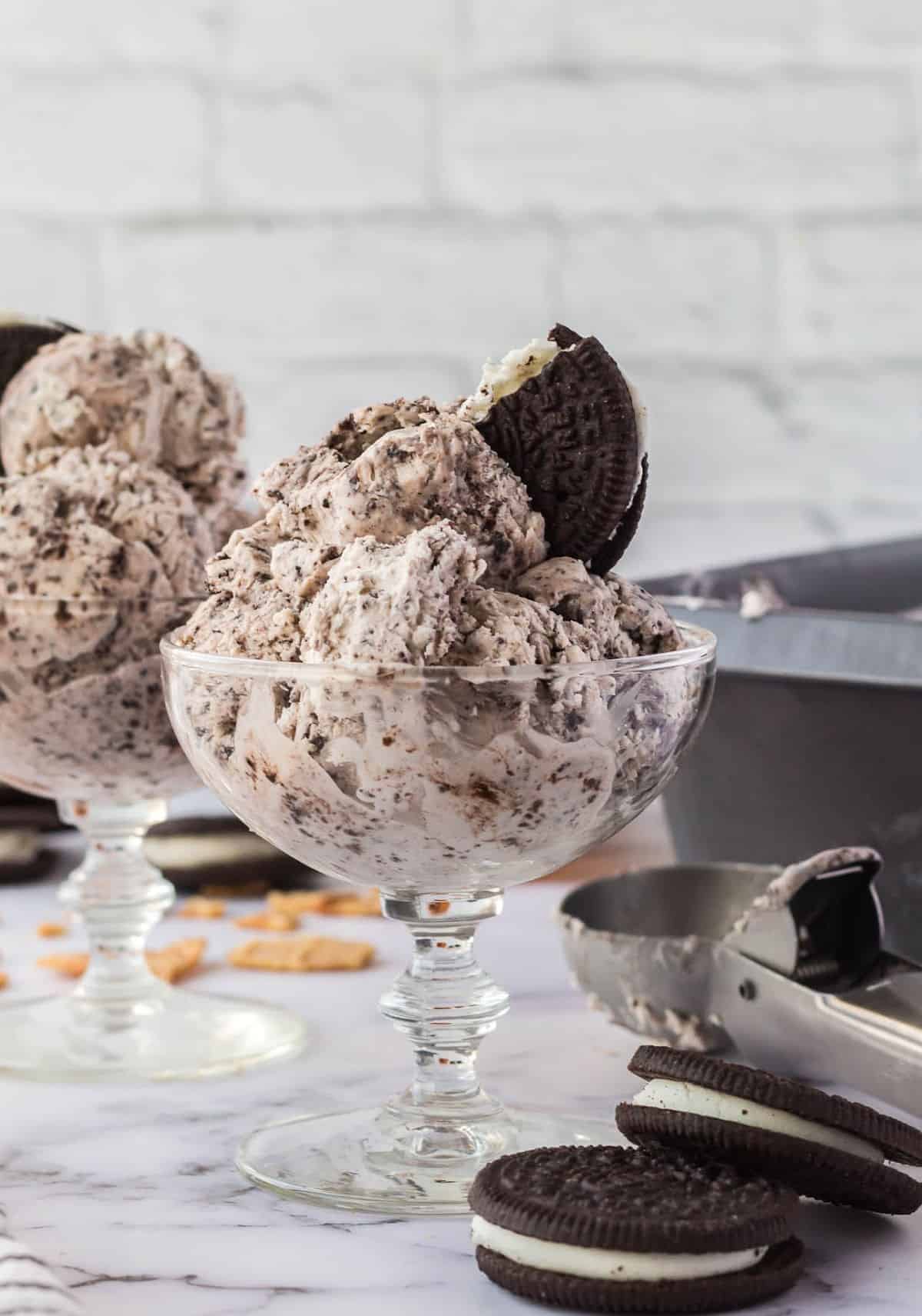 Ice cream in a bowl with a oreo on top.