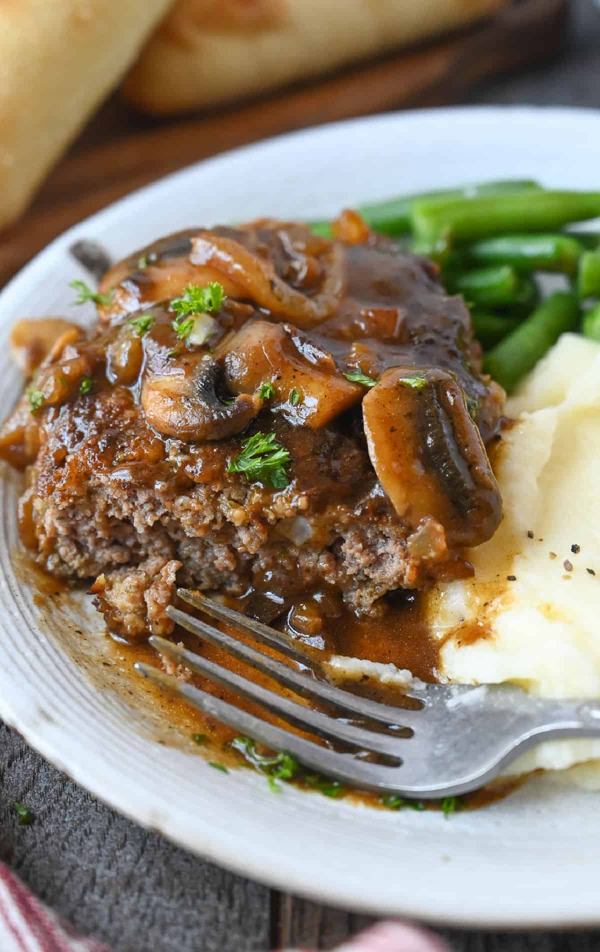 Salisbury steak with a bite out of it.