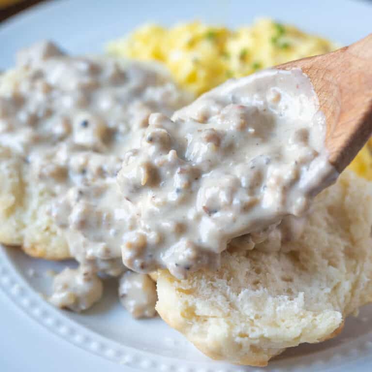 Sausage gravy spooned on top of a biscuit.