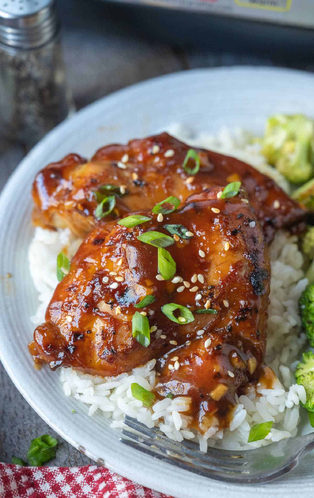 Cooked chicken on a bed of white rice.