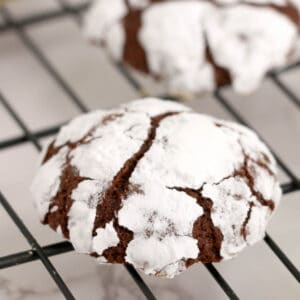 Chocolate crinkle cookie on a cooling rack.
