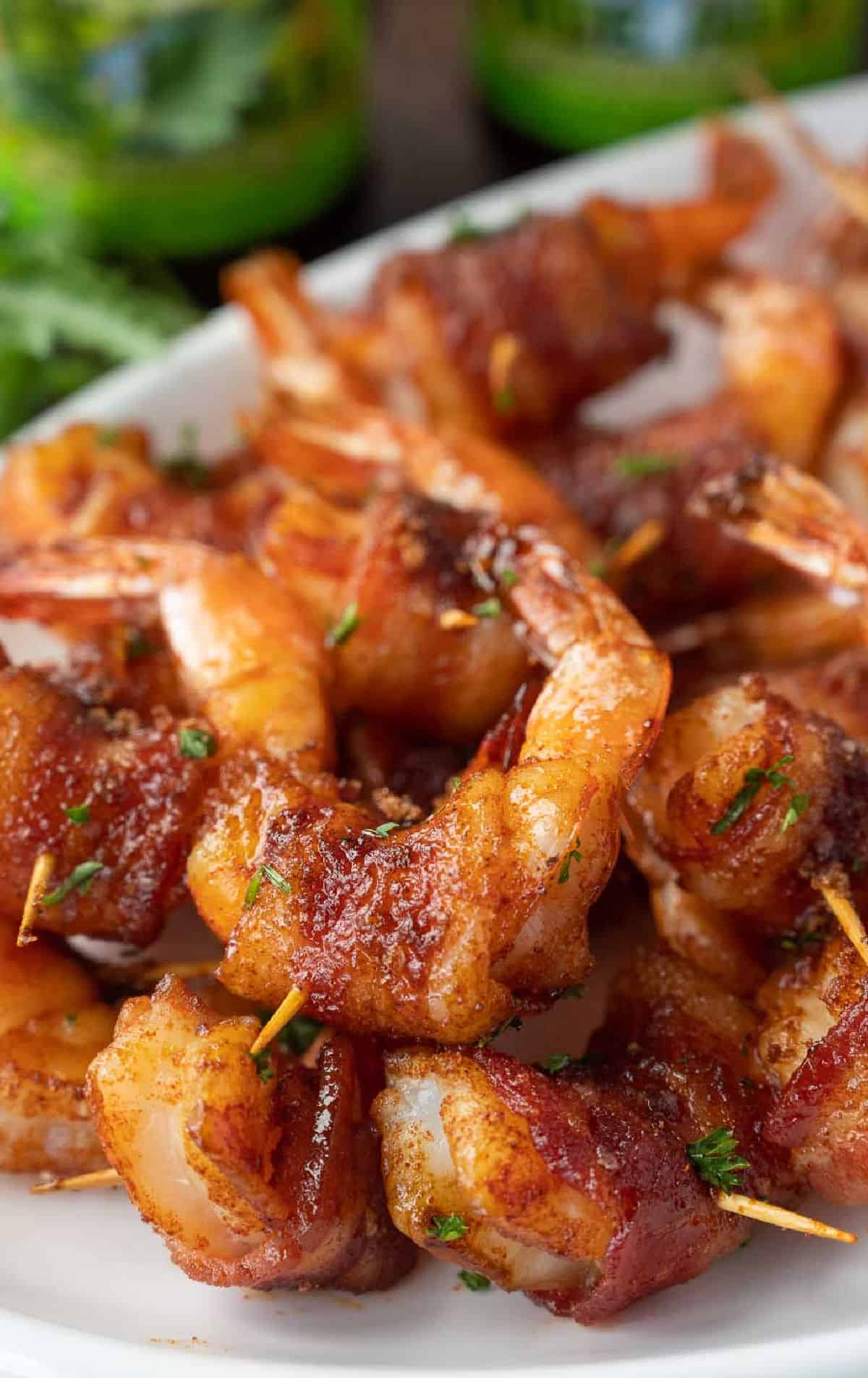 A plate of bacon wrapped shrimp.