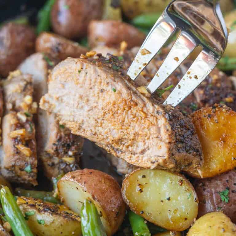 Pork tenderloin slice on a fork.