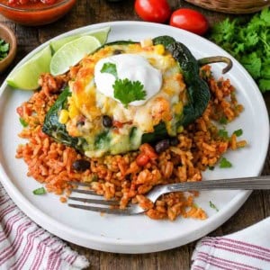 Chicken and cheese stuffed poblano peppers on some mexican rice.