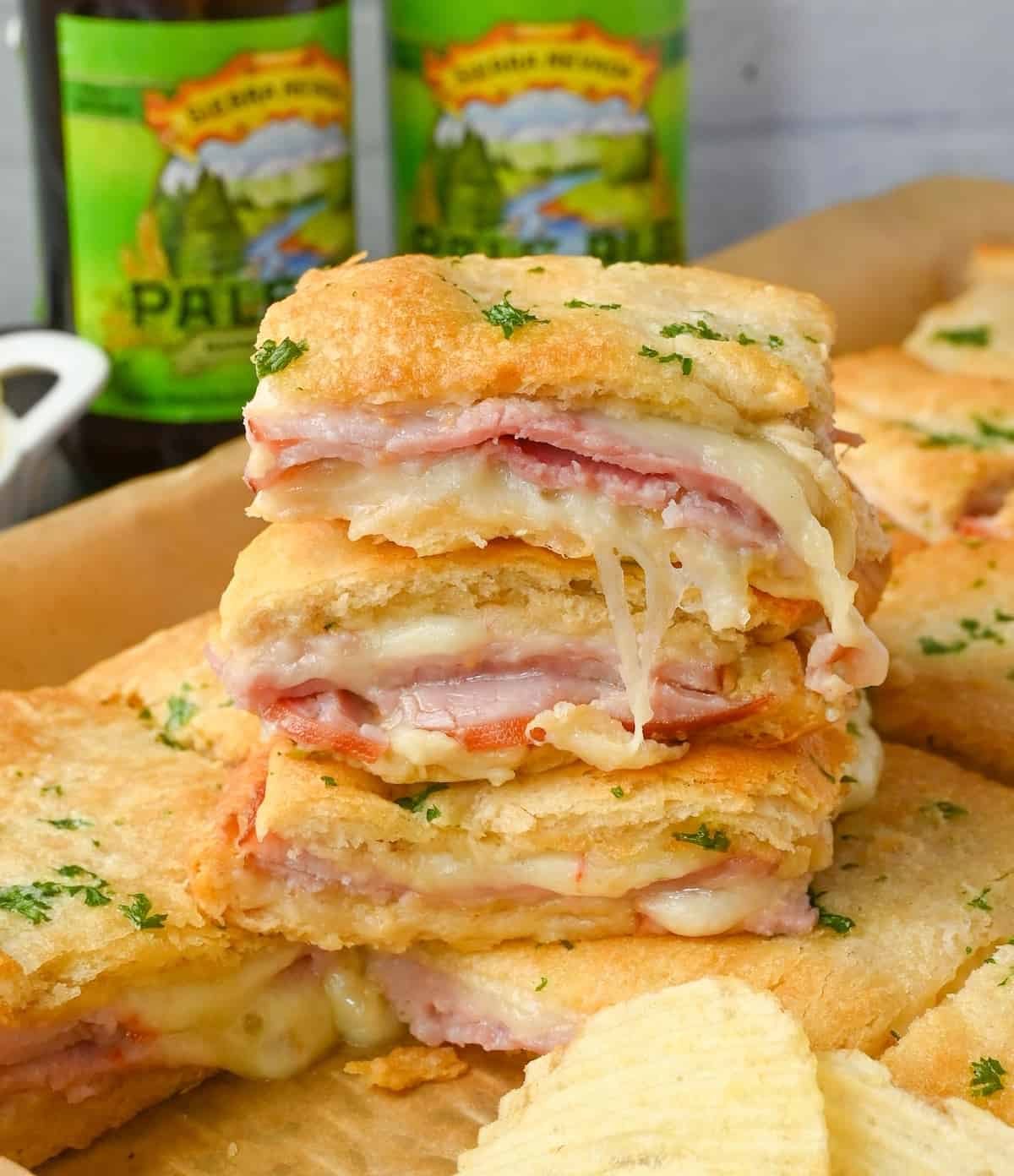 A stack of hot ham sandwiches.