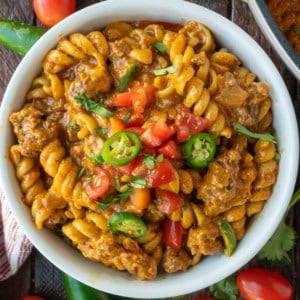 Close up of one pot enchilada pasta in a white bowl.