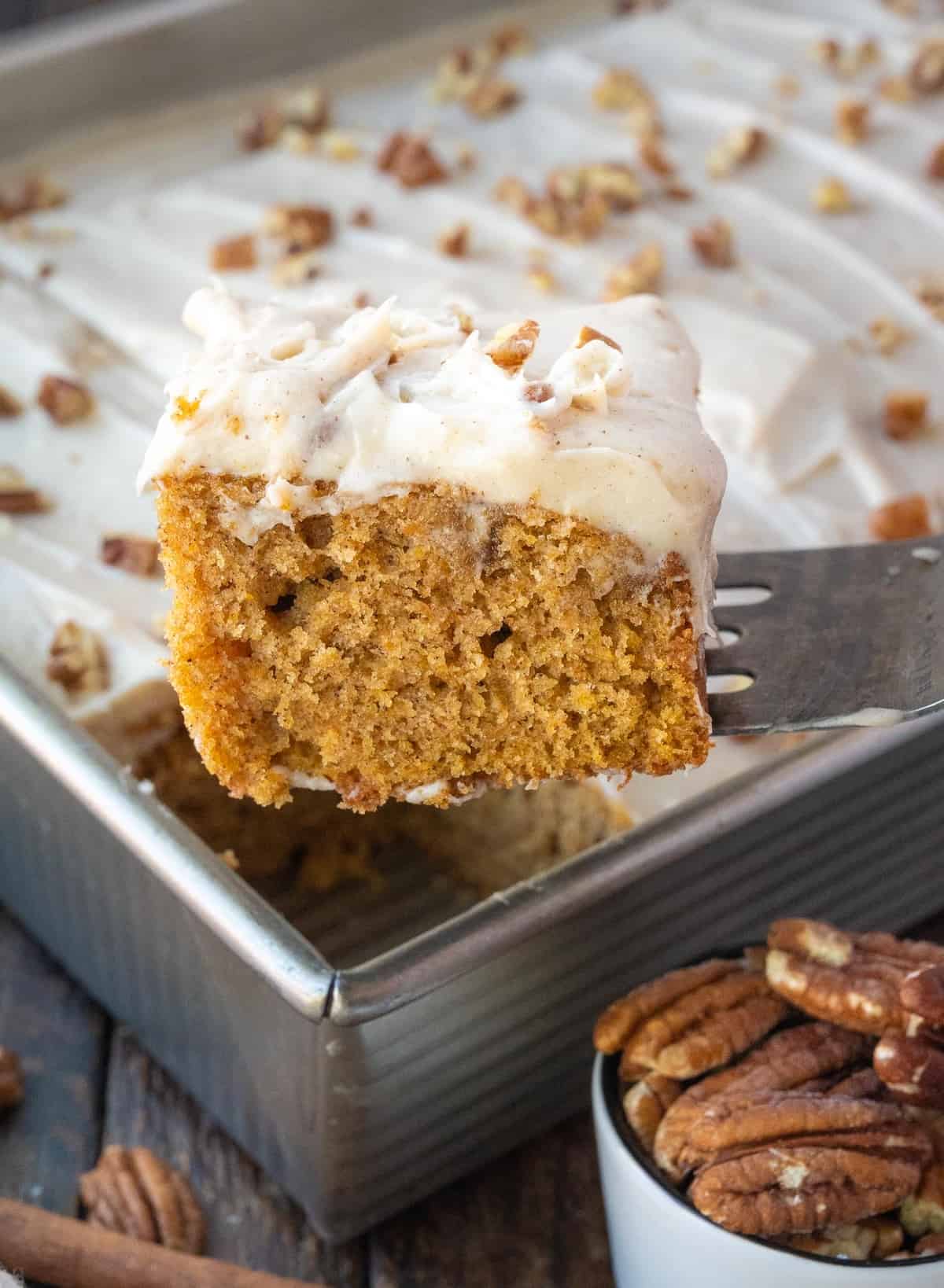 A slice of sweet potato cake being picked up with a spatula.